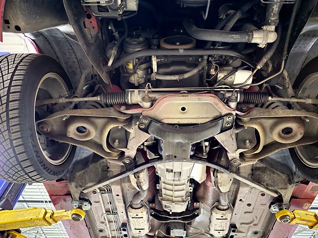 Full length from the front: K-member, steering rack, floor