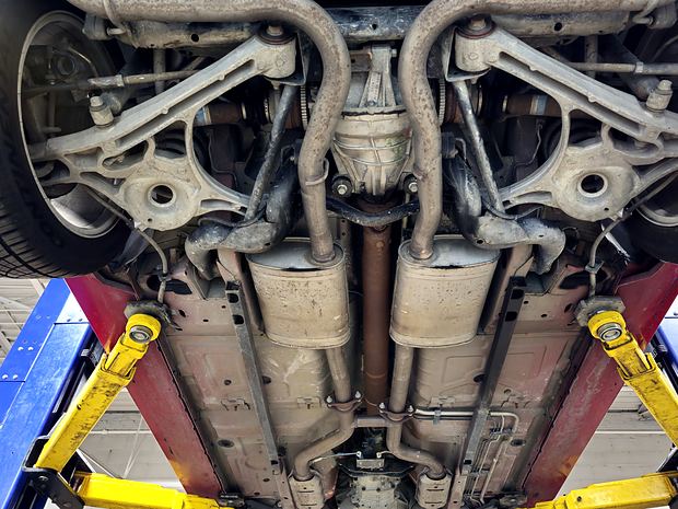 Independent rear suspension and mufflers